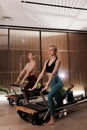 Women practicing Pilates with reformers in a Royalty Free Stock Photo
