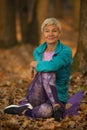 Women practicing yoga in autumn park, Ukraine. Chernihiv