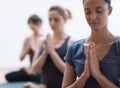 Women practicing yoga and meditation