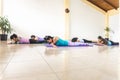Women practicing yoga and relaxation lying on their stomachs Royalty Free Stock Photo