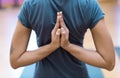 Women practicing yoga: reverse prayer pose