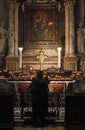 Women pray at the altar of the Virgin Mary