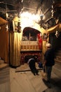 Women pray at the silver star marks the traditional site of Jesus` birth in a grotto underneath Bethlehem`s Church of the Nativity