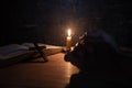 Women praying on the Bible in the light candles selective focus Royalty Free Stock Photo