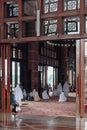 Women are praying in Putra Mosque in Wilayah Persekutuan Putrajaya, Malaysia