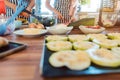 Women preparing dishes for garden party in the kitchen