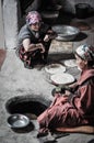 Women preparing flat cakes in Tajikistan