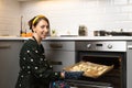 Women preparing homemade food pie, pizza in a cozzy kitchen. Hobbies and family life concept Royalty Free Stock Photo