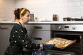 Women preparing homemade food pie, pizza in a cozzy kitchen. Hobbies and family life concept Royalty Free Stock Photo