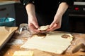 Women preparing homemade food pie, pizza in a cozzy kitchen. Hobbies and family life concept Royalty Free Stock Photo