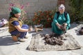 Women preparing wool for traditional felt making