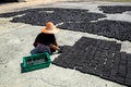 Women put charcoal pack bar made from coconut shell on the floor Royalty Free Stock Photo