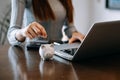 Women are putting coins in a piggy bank for a business that grows for profit and saving money for the future. planning for Royalty Free Stock Photo