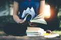 Women read books in quiet nature.