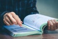 Women read holiday book in room quiet environment