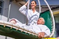 Women realxing on lounger in spa