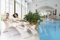Women Relaxing Around Pool At Spa Royalty Free Stock Photo