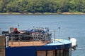 Women relaxing on a cruising ship, near a lot of bicycles.