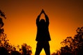 Women relaxing and exercising on moning of sihouette sky background Royalty Free Stock Photo