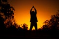 Women relaxing and exercising on moning of sihouette sky background