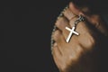 Women in religious concepts Hands praying to God while holding the cross symbol.