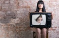 Women and retro TV. Royalty Free Stock Photo
