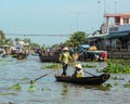 Women rowing boat at floating market in Mekong Delta, Vietnam Royalty Free Stock Photo