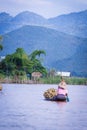 Women rowing a dugout canoe in Inle Lake, Myanmar.