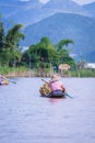 Women rowing a dugout canoe in Inle Lake, Myanmar.