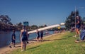 The women rowing team prepare to start with their boat on the bank of Yarra river Royalty Free Stock Photo