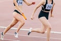 women running relay race in summer athletics championship Royalty Free Stock Photo