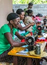 Working on donated sewing machines in rural Haiti. Royalty Free Stock Photo