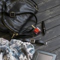 Women's accessories- black leather handbag, scarf, watch, nail Polish, mascara and tablet computer Royalty Free Stock Photo