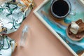 Women`s accessories - perfume, scarf, cup of coffee with biscuit on tray. Mockup for elegant concept. Flat lay, top view, copy Royalty Free Stock Photo