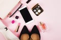 Women`s accessories - shoes, bag, cosmetics, perfume, phone on p Royalty Free Stock Photo