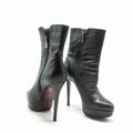 Women`s ankle boots made of black genuine leather Royalty Free Stock Photo