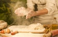 Women`s baker hands mixing, kneading dough and making bread Royalty Free Stock Photo