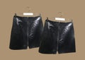 Women`s black mock croc mini skirts with zip