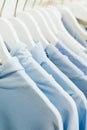 women`s blue things hang on hangers in the store. Royalty Free Stock Photo