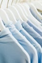 women`s blue things hang on hangers in the store.