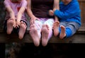 Women`s and children`s feet Royalty Free Stock Photo