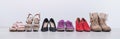 Women`s choice of footwear for all seasons. Female shoes in a row on a white background Royalty Free Stock Photo