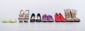 Women`s choice of footwear for all seasons. Female shoes in a row on a white background Royalty Free Stock Photo