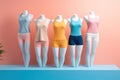 Women\'s clothes on a mannequin in front of a pink wall