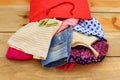 Women's clothing falls out of paper shopping bags Royalty Free Stock Photo