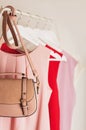 Women`s clothing in pink tones on a white hanger. Royalty Free Stock Photo