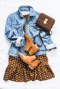 Women`s clothing for spring, summer, autumn - denim jacket oversize, polka dot dress, suede chelsea boots and cross body bag on a