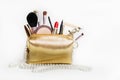 Women`s cosmetics. Gold cosmetic bag