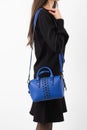 Women& x27;s dark blue leather bag in vintage style, black lock, front view. The trendy purse office, business trips or Royalty Free Stock Photo