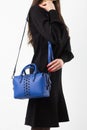 Women& x27;s dark blue leather bag in vintage style, black lock, front view. The trendy purse office, business trips or Royalty Free Stock Photo